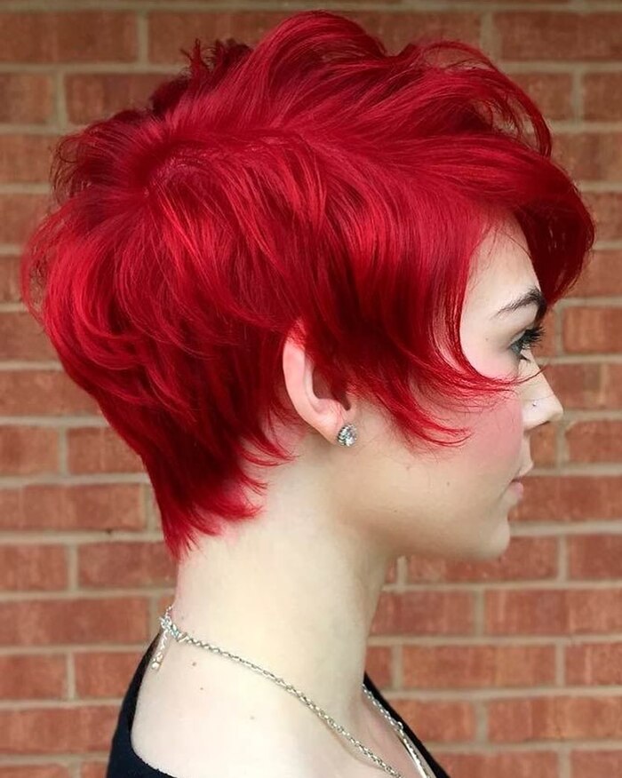 Photo of Young Girl With Hot Red Pixie Bob Dramatic Look