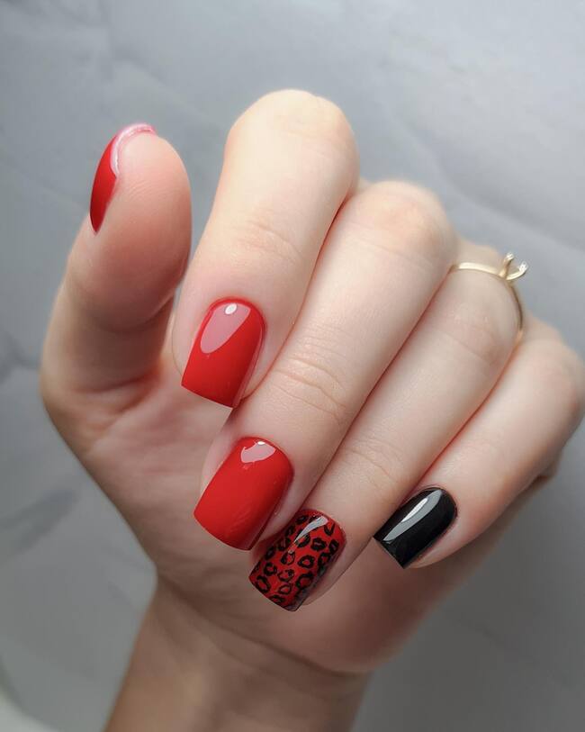 Red Nails With Black Patterns