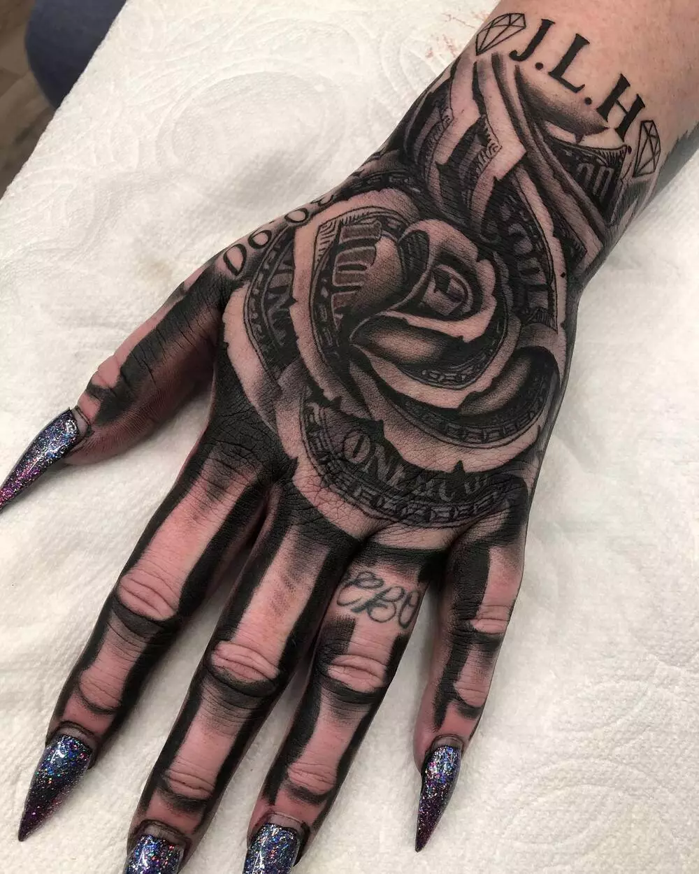 Female Skeleton Hand and Money Rose Tattoo 