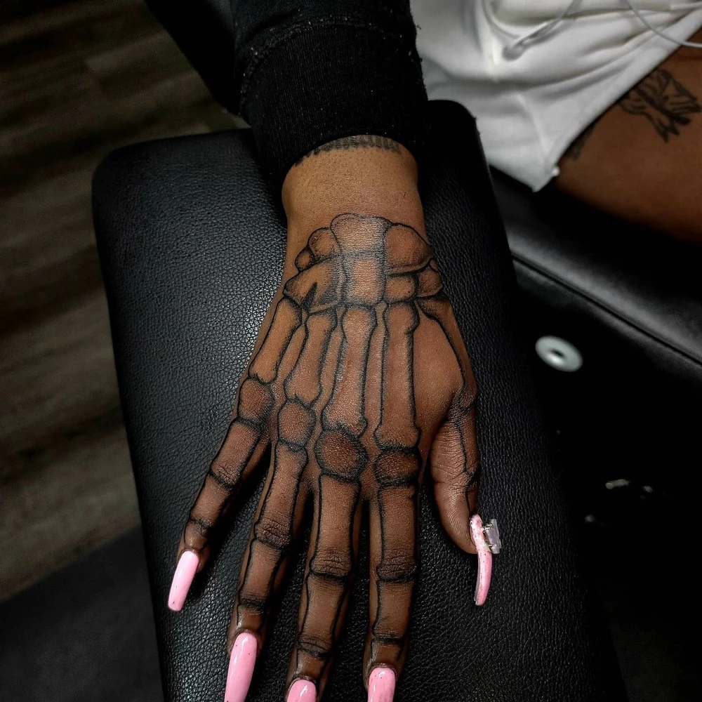 Female Outline Skeleton Hand Tattoo 
