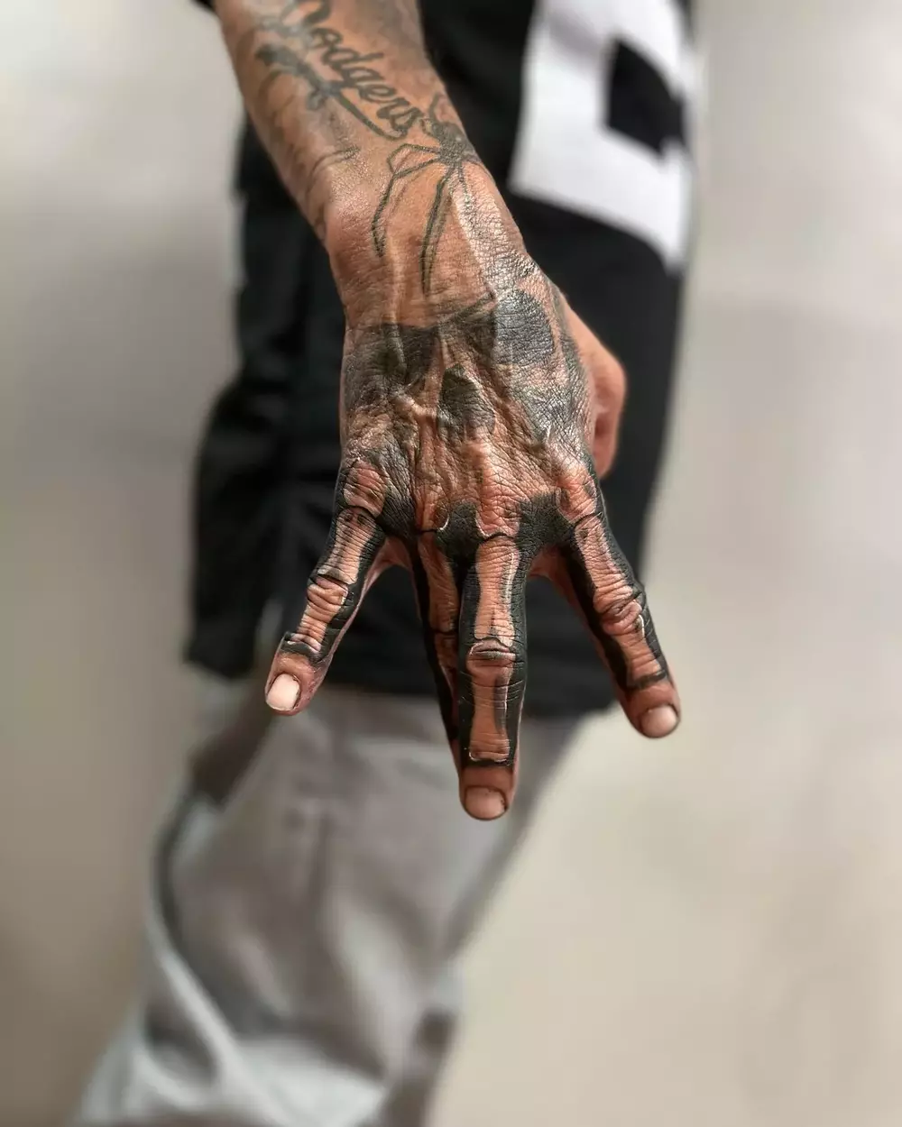 Blackwork Skeleton Hand Tattoo for Men