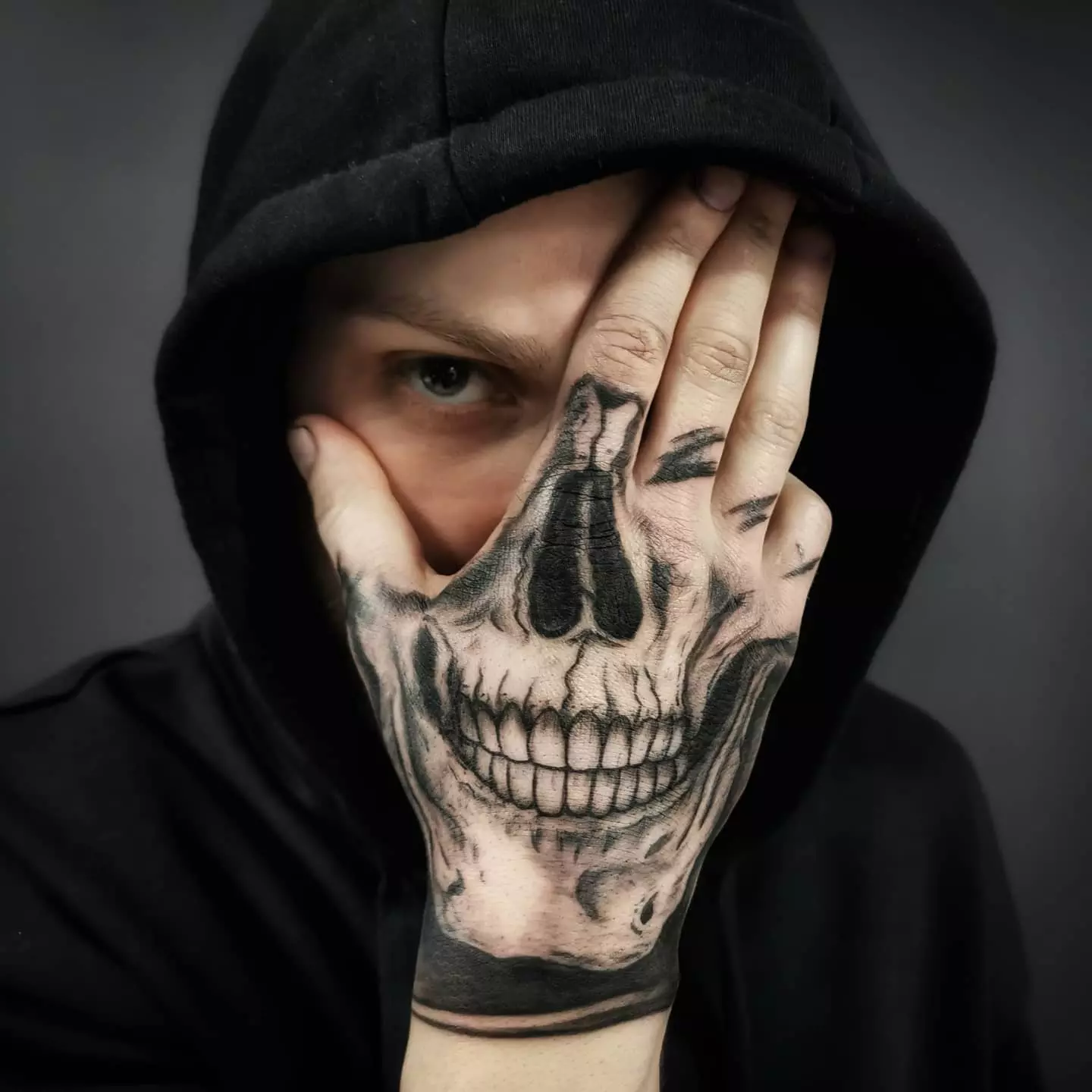 One More Example of Skeleton Smiling Face Hand Tattoo
