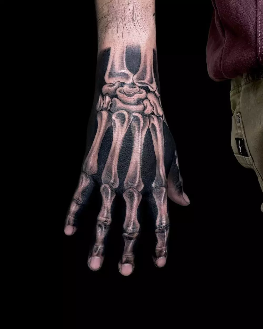 A Close-up Photo of Blackwork Skeleton Bone Hand Tattoo Like a Real One