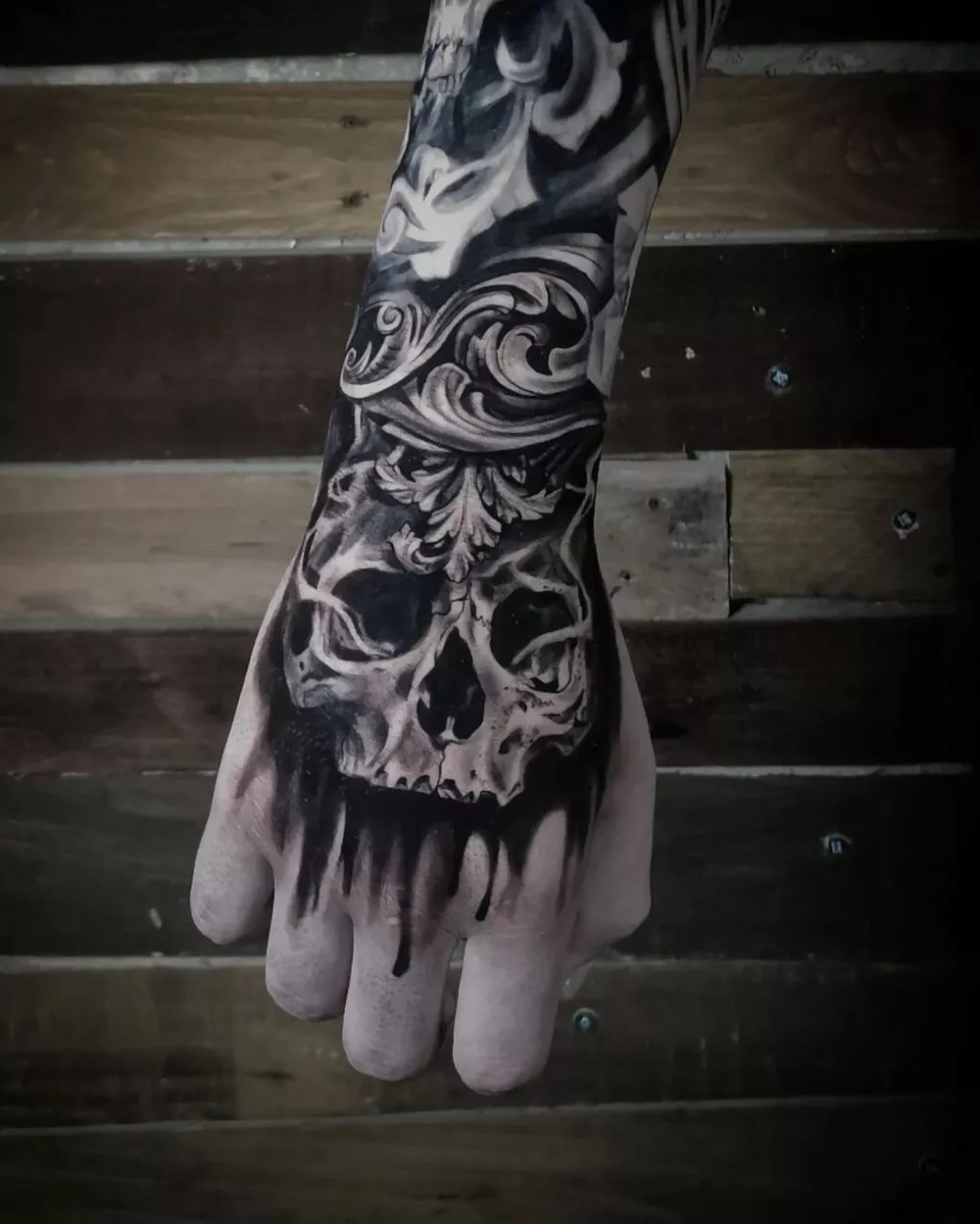 Black and Gray Skeleton Skull Hand Tattoo Example