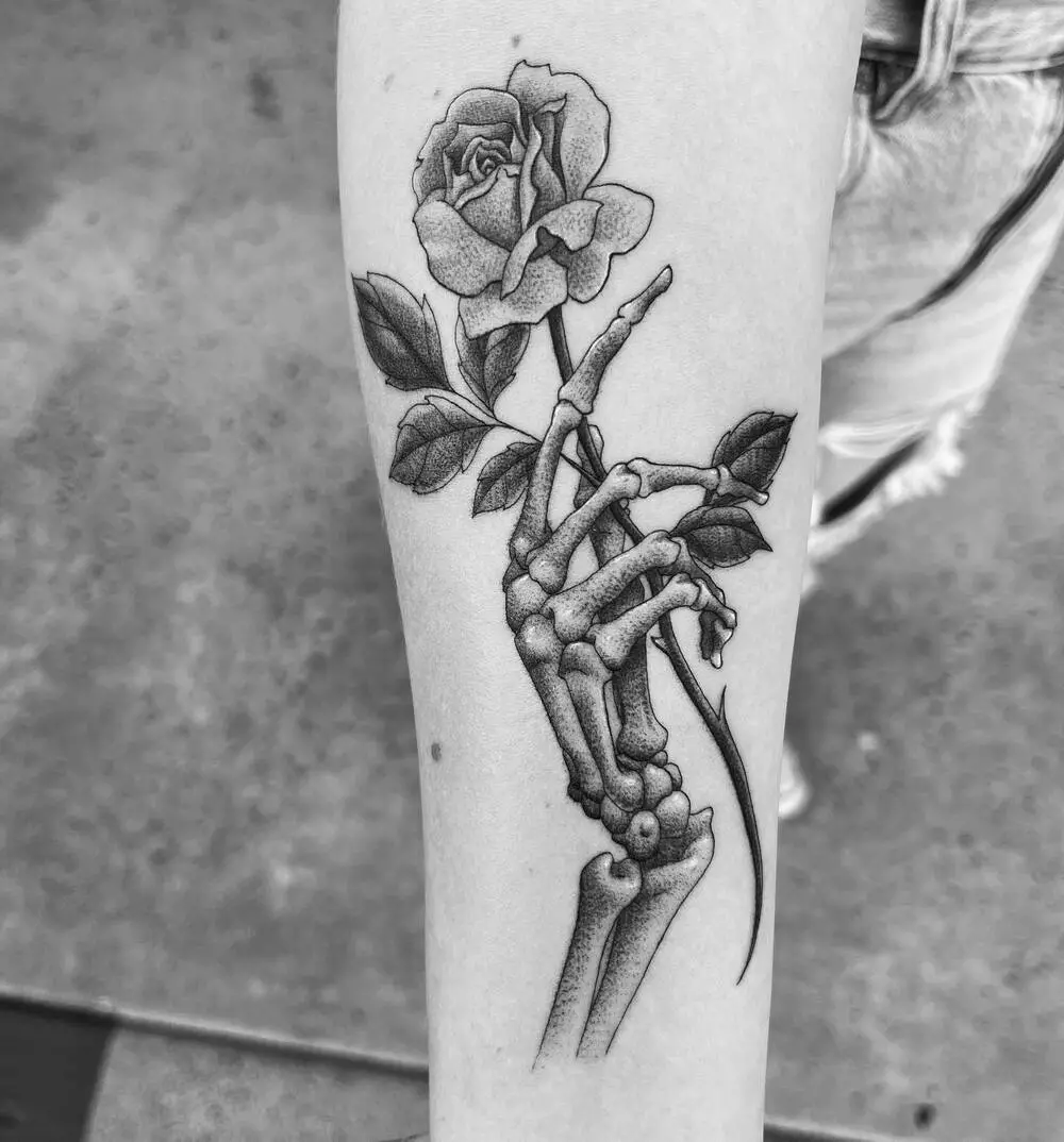 Skeleton Hand Holding Rose Gray Tattoo