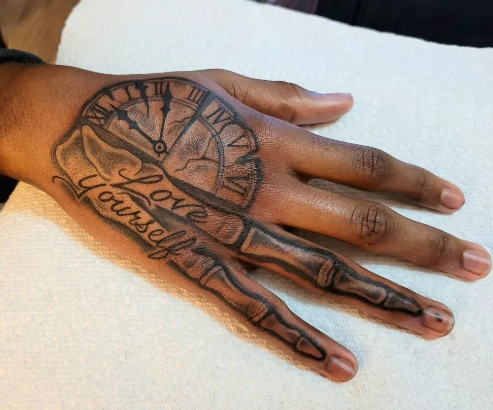 One More Example of Skeleton Fingers and Clock Hand Tattoo