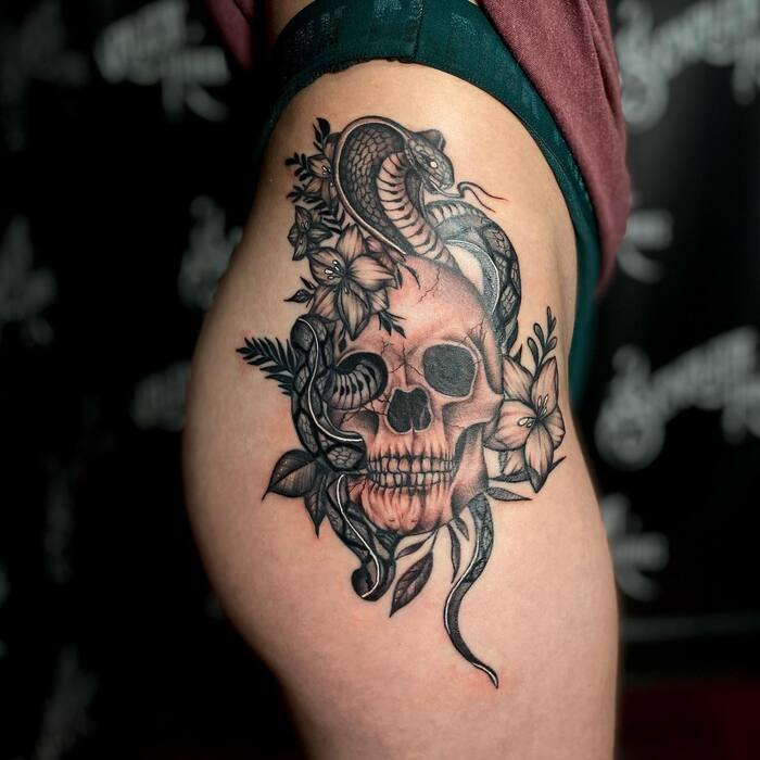 Close-up Image of the Skull And Snake Black Tattoo