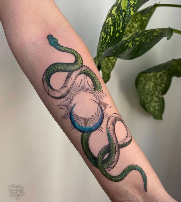 Close-up Image of the Green Snake and Moon Tattoo