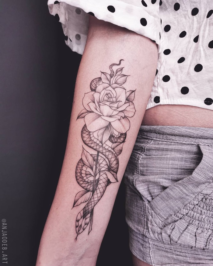 Close-up Image of the Snake And Rose Tattoo in Black and Gray