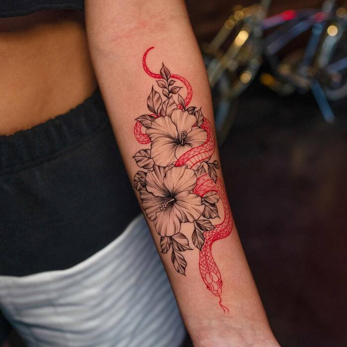Close-up Image of the Red Snake and Hibiscus Tattoo