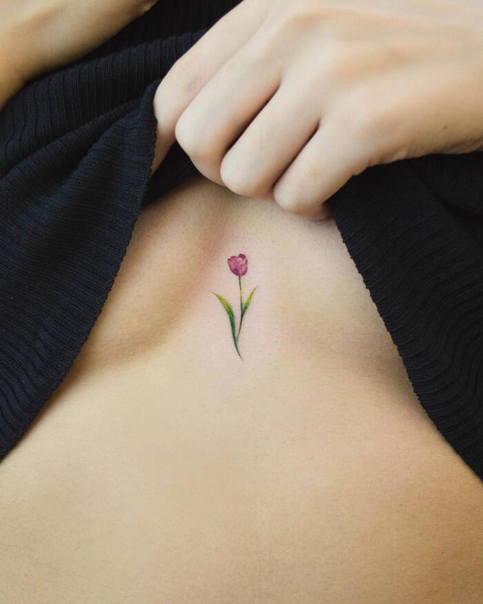 Small Flower Sternum Tattoo 