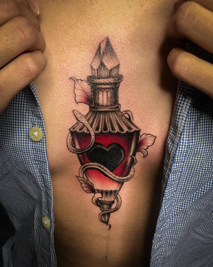 Witchy Sternum Tattoo In Black And Red