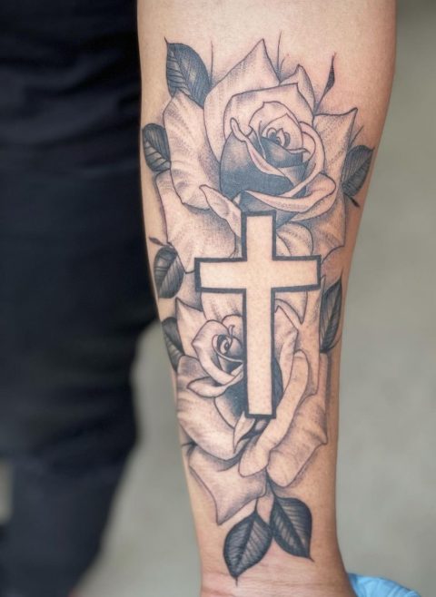 Cross with roses tattoo