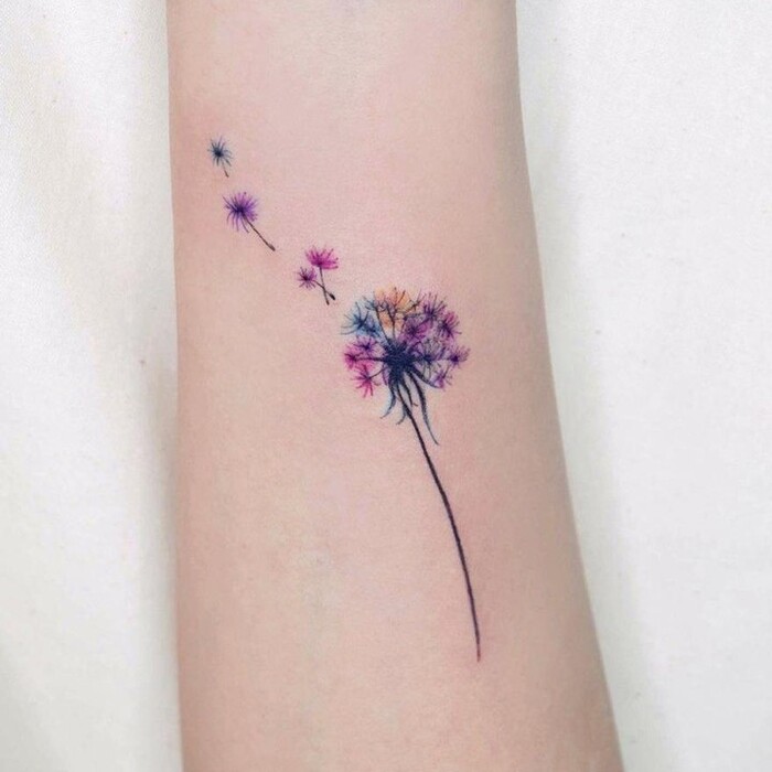 Watercolor tattoo of simple dandelion flower with black stem