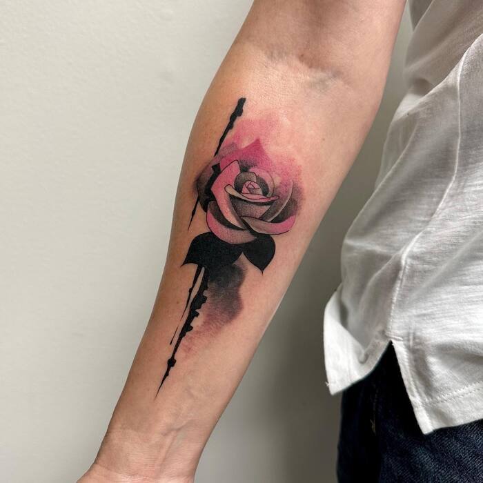 Watercolor tattoo of red rose with black stern