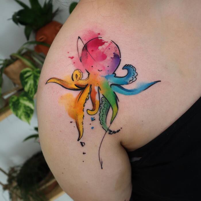 Watercolor tattoo of black fine line octopus filled by color inks