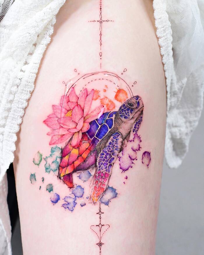 Watercolor tattoo of turtle in bright blue, red, pink, purple and green colors