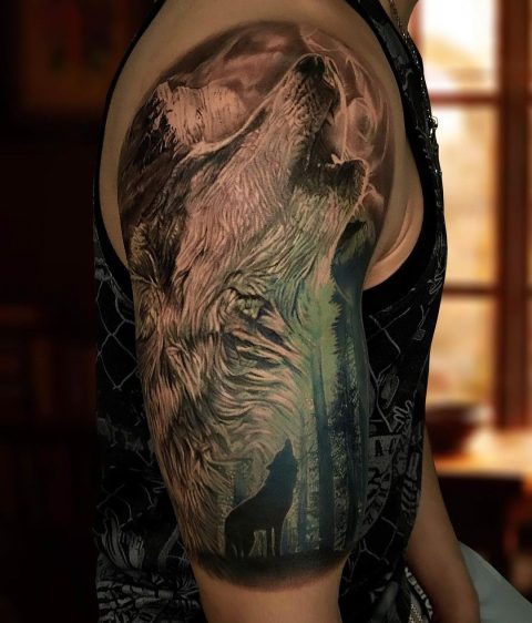 wolf and moon tattoo on shoulder