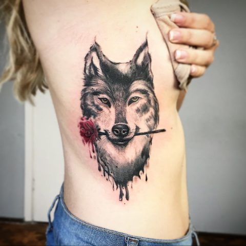 Wolf with Rose in Mouth Tattoo