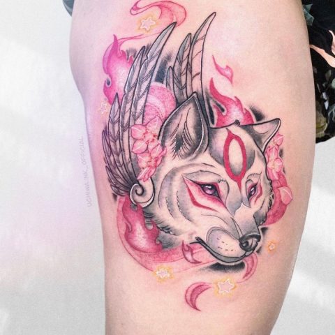 colored wolf tattoo for woman