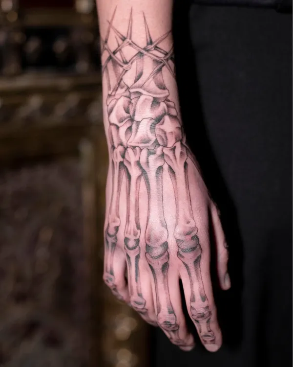 61 Skeleton Hand Tattoo Ideas With Deep Meanings